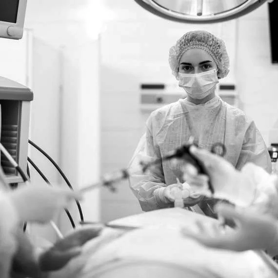 Surgical team performing a minimally invasive operation in theatre.